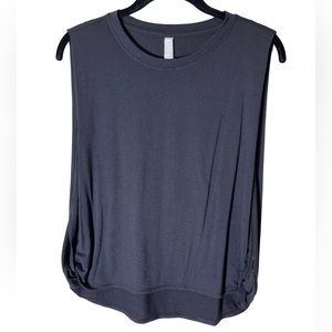 Athleta black tee with a low cut under arm in a size small and color black